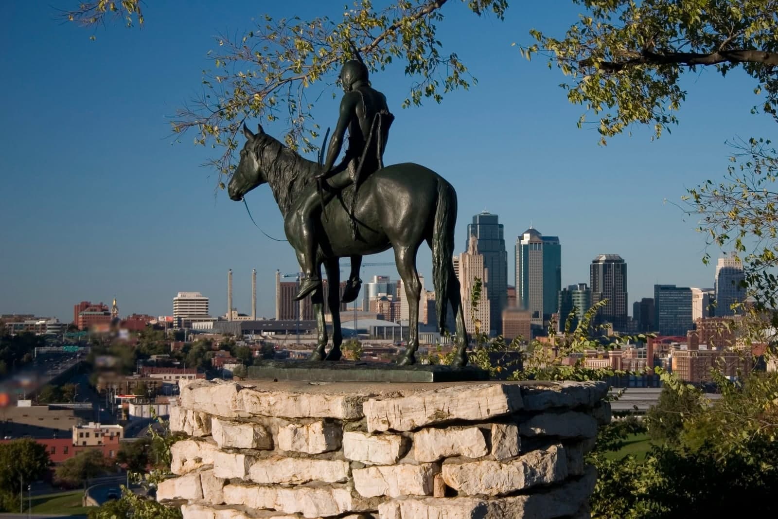 The bronze Scout statue on horseback overlooks the downtown skyline of Kansas City, Missouri
