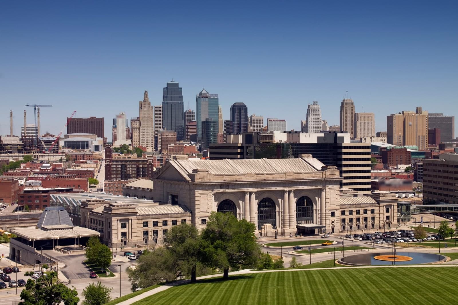 Union Station's stone front and plaza with the downtown towers rising behind it in Kansas City, Missouri